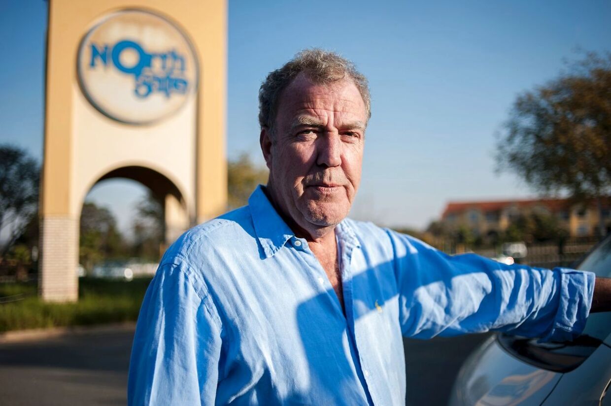 (FILES) This file photo taken on June 10, 2015 shows former Top Gear presenter Jeremy Clarkson posing next to a South African taxi at the Ticketpro Dome before the Clarkson, Hammond and May Live Show held in Johannesburg. The first episode of the new TV show presented by British TV host Jeremy Clarkson, will be publicly broadcasted next July in South Africa. / AFP PHOTO / STEFAN HEUNIS
