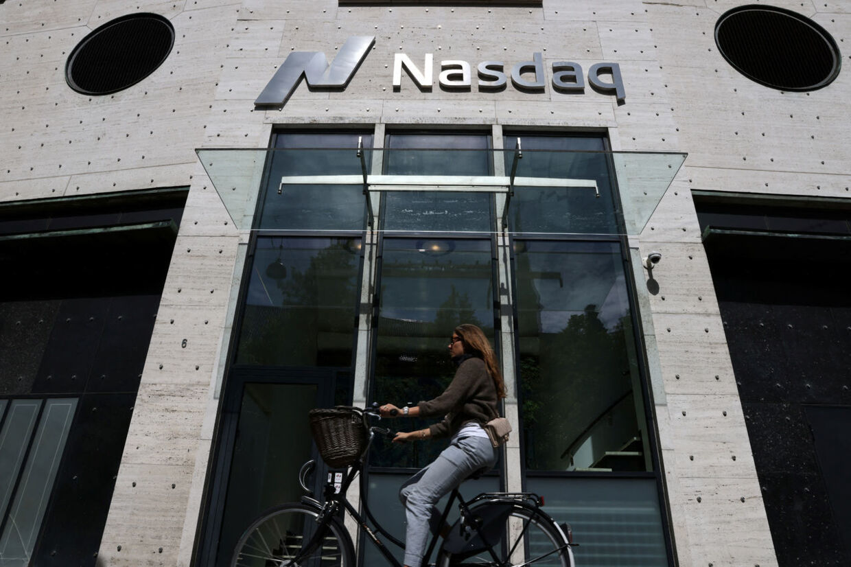 A person rides by the Nasdaq Copenhagen in Copenhagen, Denmark, July 30, 2022. REUTERS/Andrew Kelly